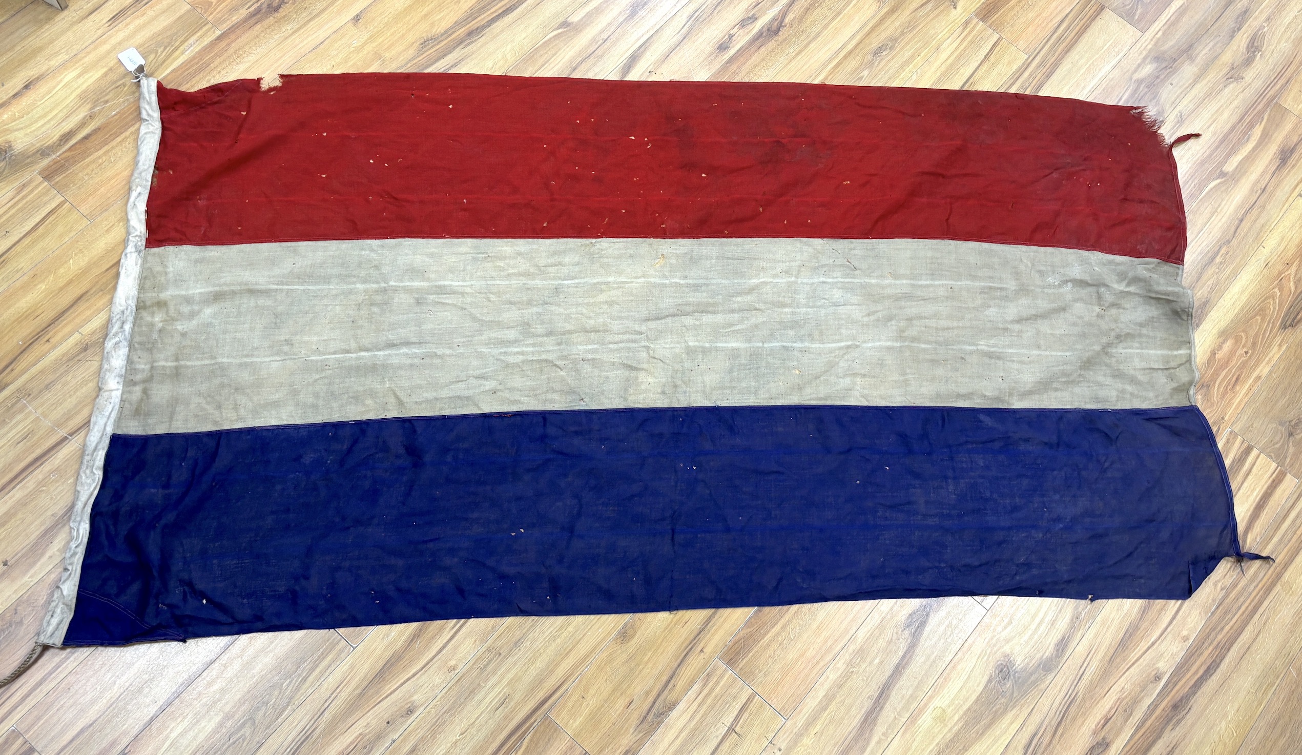 An early 20th century Soviet Union flag and an early 20th century Dutch flag